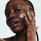 Dew More Reale Actives being applied on to a woman's skin
