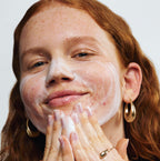 Pore Power Reale Actives Product Being applied on to a woman's face 